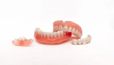 How should I care for my dentures?